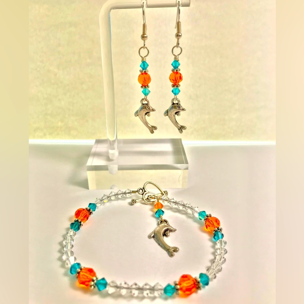 Beautiful Handcrafted teal crystal and orange crystal Dolphin earrings
